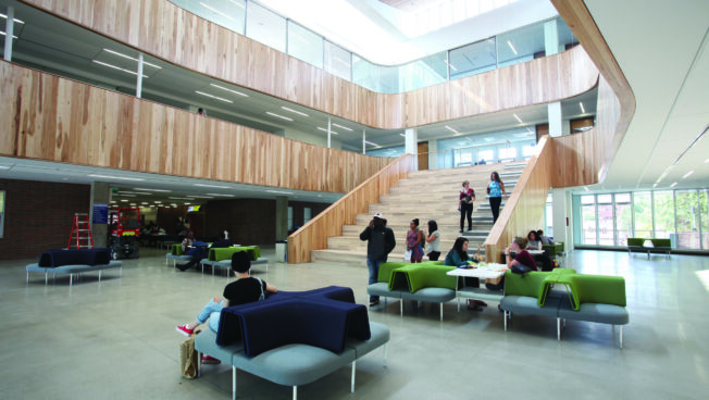 A photo of a common area in a large bright educational space
